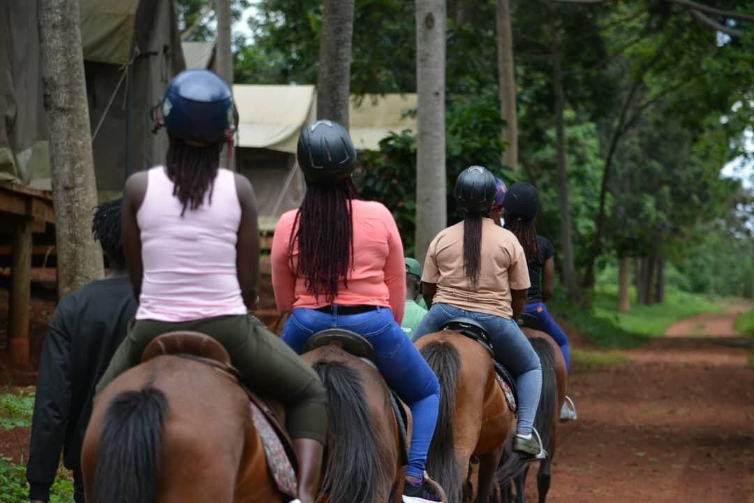 a ladies riding horses