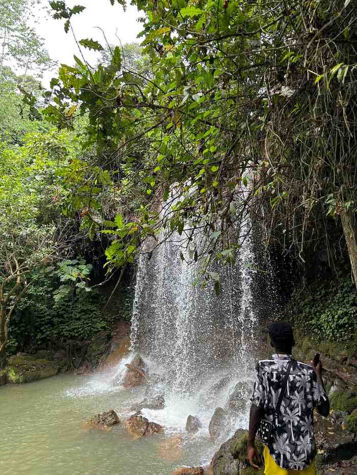 a man next to flowing water