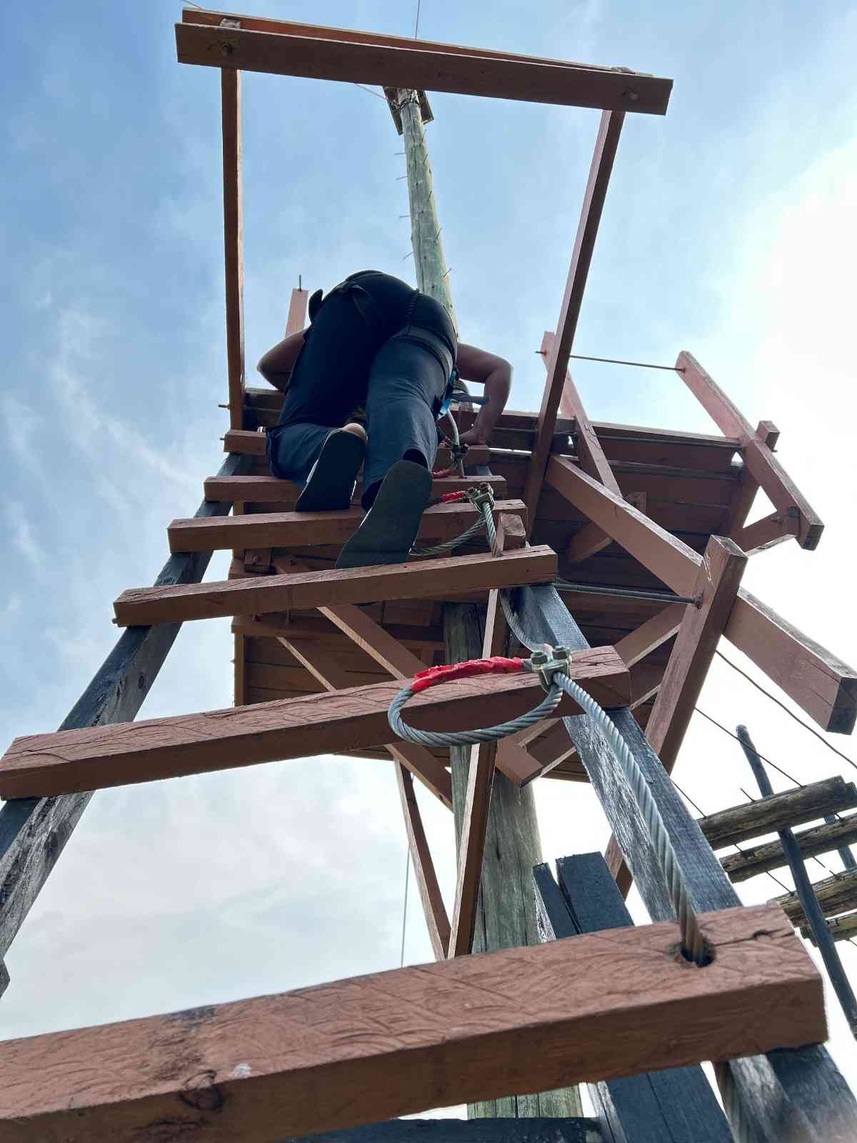 lady climbing up for ziplin