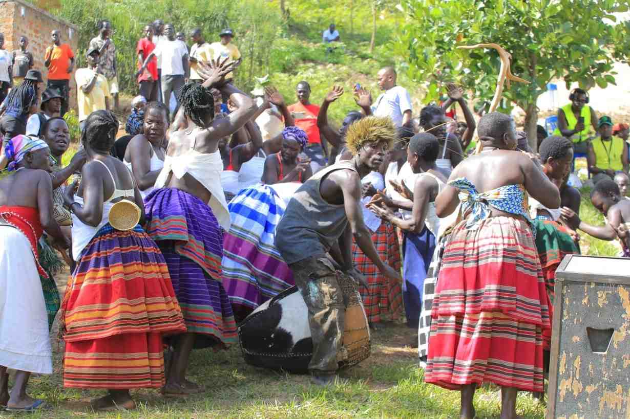 people dancing to a man druming